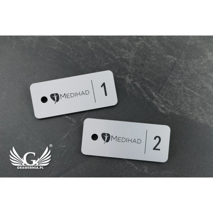 Breloczki do kluczy - TROGIR srebrny mat - 70x30mm