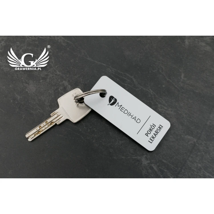 Breloczki do kluczy - TROGIR srebrny mat - 70x30mm