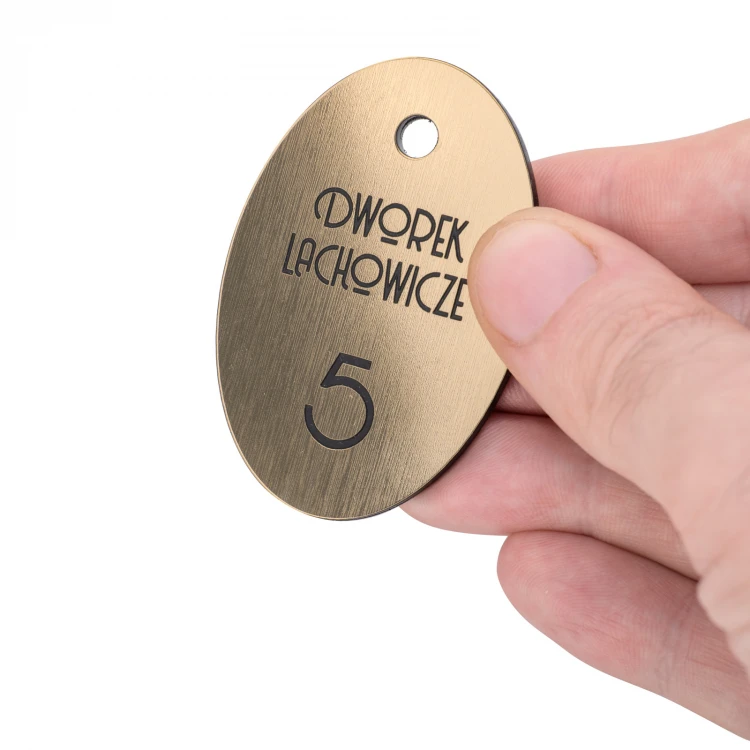 Brelok hotelowy - Oval Metalic Gold - wym. 60x40mm - BRL028 