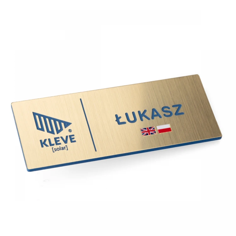 Identyfikator dla pracowników wielojęzycznych - Złoty z niebieskim grawerem i nadrukiem UV - ID138 