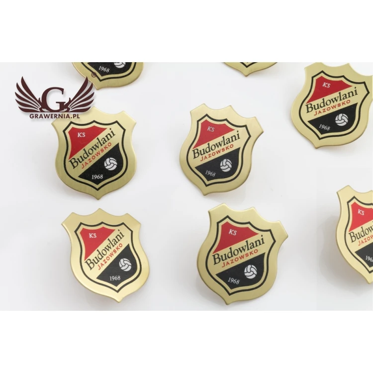Pinsy - Tarcze mosiężne z Twoim logo - wym. 27x30mm - druk UV - PS031