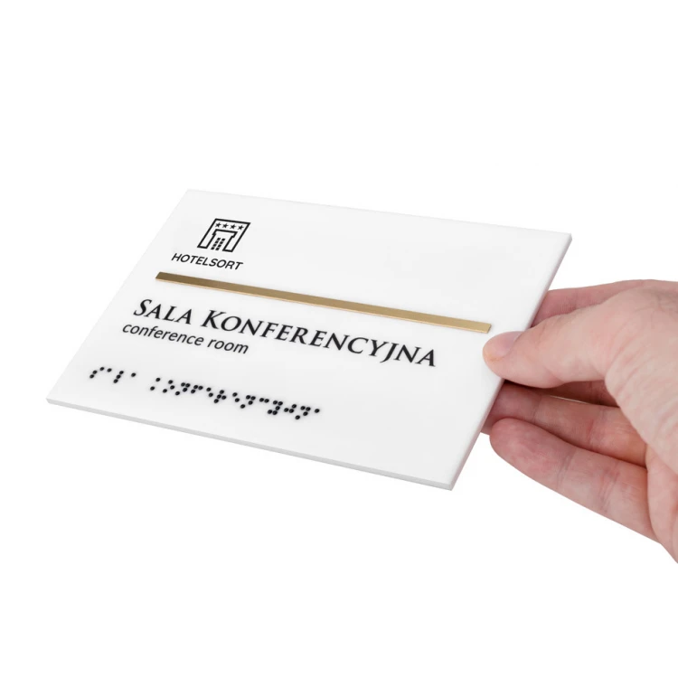 Tabliczka z pismem Braille'a - biały akryl mat i mosiądz - wym. 155x105mm - TAB396