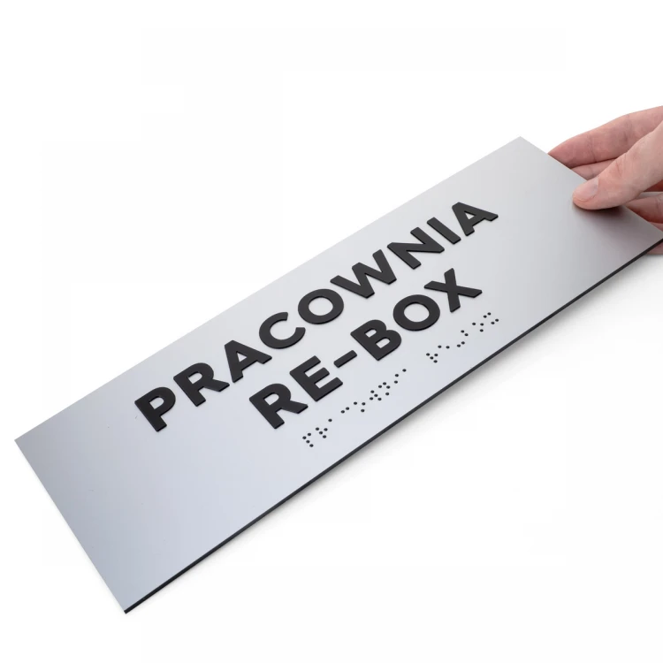 Tabliczka z wypukłymi literami i pismem Braille'a - laminat srebrny - wym. 295x100mm - TAB498