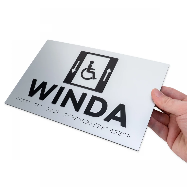 Tabliczka z wypukłymi literami i pismem Braille'a - Winda dla niepełnosprawnych - laminat srebrny - wym. 250x160mm - TAB502