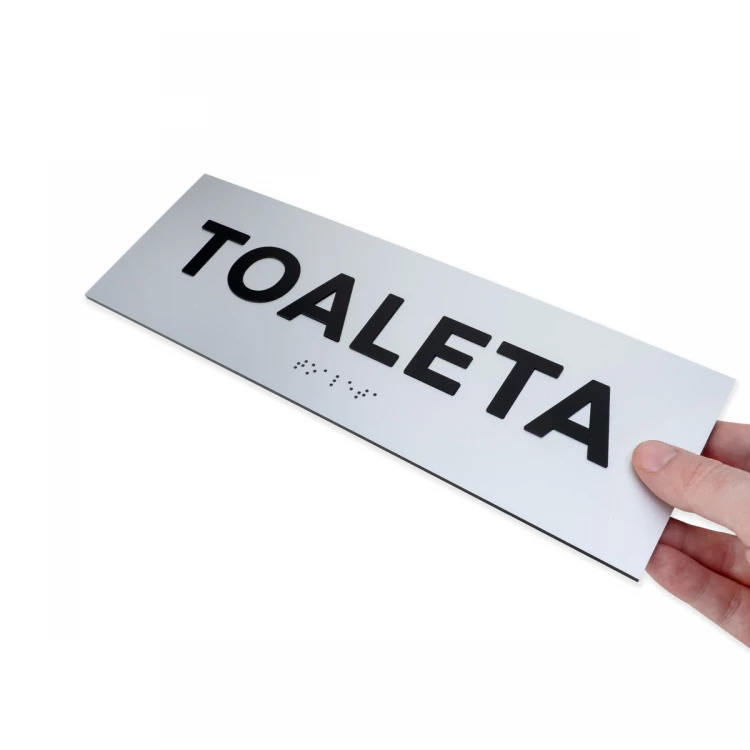 Tabliczka z wypukłymi literami i pismem Braille'a - Toaleta - laminat srebrny - wym. 295x100mm - TAB503