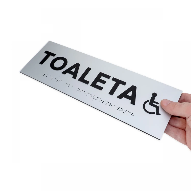 Tabliczka z wypukłymi literami i pismem Braille'a - Toaleta dla niepełnosprawnych - laminat srebrny - wym. 295x100mm - TAB506