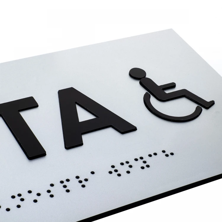 Tabliczka z wypukłymi literami i pismem Braille'a - Toaleta dla niepełnosprawnych - laminat srebrny - wym. 295x100mm - TAB506